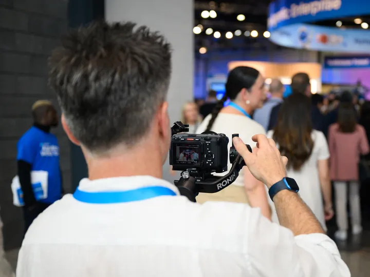 Our videographer filming the crowd at a conference on a gimbal