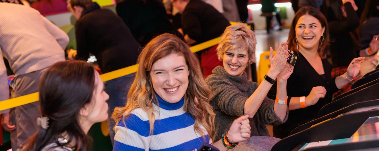Colleagues laughing together at a Christmas party